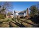 Large backyard with a home and deck at 302 S College St, Monroe, NC 28112