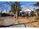 Large backyard with gravel driveway and shed at 302 S College St, Monroe, NC 28112