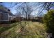 Large grassy backyard with mature trees at 302 S College St, Monroe, NC 28112