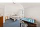 Cozy bedroom with a single bed, desk, and wood floors at 302 S College St, Monroe, NC 28112