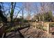Wooden deck overlooks the backyard and provides ample space for outdoor relaxation at 302 S College St, Monroe, NC 28112