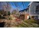 Spacious deck with storage area and steps leading to yard at 302 S College St, Monroe, NC 28112