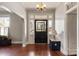 Front entry with hardwood floors and a charming stained-glass door at 302 S College St, Monroe, NC 28112