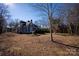Spacious yard with mature trees and landscaping at 302 S College St, Monroe, NC 28112