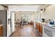 Galley kitchen with stainless steel appliances and tile floor at 302 S College St, Monroe, NC 28112