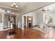 Living room features hardwood floors, fireplace, and large windows at 302 S College St, Monroe, NC 28112