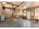 Spacious living room featuring exposed wooden beams and slate flooring at 302 S College St, Monroe, NC 28112