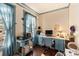 Home office with built-in desk and large windows for natural light at 302 S College St, Monroe, NC 28112