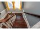 Classic wooden staircase with white railings leading to the upper level at 302 S College St, Monroe, NC 28112