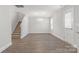 Bright dining room with wood-look flooring and chandelier at 3024 Seymour Dr, Charlotte, NC 28208