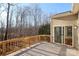 Wooden deck with glass door access to the house and treeline views at 4030 Garden Oak Dr, Indian Trail, NC 28079