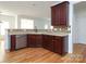 Kitchen boasts dark wood cabinets, granite counters at 4030 Garden Oak Dr, Indian Trail, NC 28079