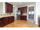Kitchen features stainless steel appliances and wood flooring at 4030 Garden Oak Dr, Indian Trail, NC 28079