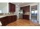 Kitchen with dark wood cabinets and stainless steel appliances at 4030 Garden Oak Dr, Indian Trail, NC 28079
