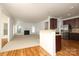 Open concept kitchen and living room with hardwood and carpet floors at 4030 Garden Oak Dr, Indian Trail, NC 28079