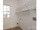 Laundry room with wire shelving and vinyl flooring at 4030 Garden Oak Dr, Indian Trail, NC 28079