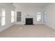 Living room with fireplace and multiple windows at 4030 Garden Oak Dr, Indian Trail, NC 28079