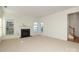 Living room with fireplace, carpet and view to staircase at 4030 Garden Oak Dr, Indian Trail, NC 28079