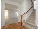 Staircase with wood railing leading to the second floor at 4030 Garden Oak Dr, Indian Trail, NC 28079