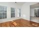 Bright sunroom features hardwood floors and multiple windows at 4030 Garden Oak Dr, Indian Trail, NC 28079