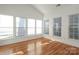 Sunroom with hardwood floors and wall-to-wall windows at 4030 Garden Oak Dr, Indian Trail, NC 28079