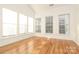 Sunroom with hardwood floors and large windows at 4030 Garden Oak Dr, Indian Trail, NC 28079