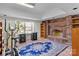 Basement area featuring a brick fireplace and neutral walls at 411 Major Run, Cramerton, NC 28032