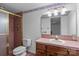 Cozy bathroom featuring a shower, toilet, sink, and vanity at 411 Major Run, Cramerton, NC 28032