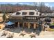 Exterior view of building with stone facade and outdoor tables at 411 Major Run, Cramerton, NC 28032