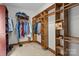 A large closet features wood organizers, shelves and clothing racks at 411 Major Run, Cramerton, NC 28032