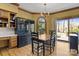 Charming dining area featuring natural light, hardwood floors, and a built-in hutch for storage at 411 Major Run, Cramerton, NC 28032