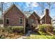 Charming red brick home with a well-maintained lawn and mature landscaping, perfect for curb appeal at 411 Major Run, Cramerton, NC 28032