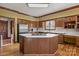 This kitchen features wood cabinets, stainless steel fridge, and a cooking surface at 411 Major Run, Cramerton, NC 28032
