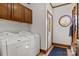 A laundry room features a washer, dryer, and access to a closet and the outside at 411 Major Run, Cramerton, NC 28032