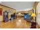 Inviting living space with hardwood floors connecting to an open-concept kitchen and dining area at 411 Major Run, Cramerton, NC 28032