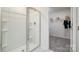 Bathroom with shower and built-in shelving at 5149 Fireweed Ct, Dallas, NC 28034