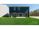 Dark-grey siding house with sliding glass door to backyard patio at 5149 Fireweed Ct, Dallas, NC 28034