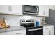 Modern kitchen features granite countertops and stainless steel appliances at 5149 Fireweed Ct, Dallas, NC 28034