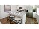 Modern kitchen with white cabinets, granite countertops, and stainless steel appliances at 5149 Fireweed Ct, Dallas, NC 28034