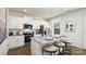 Modern kitchen with white cabinets, granite countertops, and stainless steel appliances at 5149 Fireweed Ct, Dallas, NC 28034