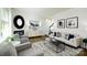 Living room with hardwood floors, gray armchairs, fireplace, and stylish decor at 5149 Fireweed Ct, Dallas, NC 28034