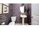 Powder room with pedestal sink and herringbone floor at 5149 Fireweed Ct, Dallas, NC 28034