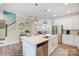 Modern kitchen with white cabinets, island, and stainless steel appliances at 5531 Stafford Rd # 35, Charlotte, NC 28215