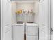 Laundry closet with washer, dryer, and shelving at 6129 Artigas Dr, Indian Land, SC 29707