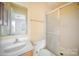 Bathroom with shower stall, toilet, and sink at 6303 Windsor Gate Ln, Charlotte, NC 28215