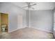 Spacious bedroom with carpet flooring and access to a private bathroom at 6303 Windsor Gate Ln, Charlotte, NC 28215