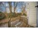 Wooden deck overlooking a backyard with trees at 6303 Windsor Gate Ln, Charlotte, NC 28215