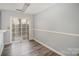 Small dining area adjacent to the kitchen, with access to a back patio at 6303 Windsor Gate Ln, Charlotte, NC 28215