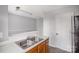Simple kitchen with double sink and wood cabinets at 6303 Windsor Gate Ln, Charlotte, NC 28215