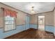 Dining room with hardwood floors and light blue wainscoting at 664 Freemont Dr, Lancaster, SC 29720